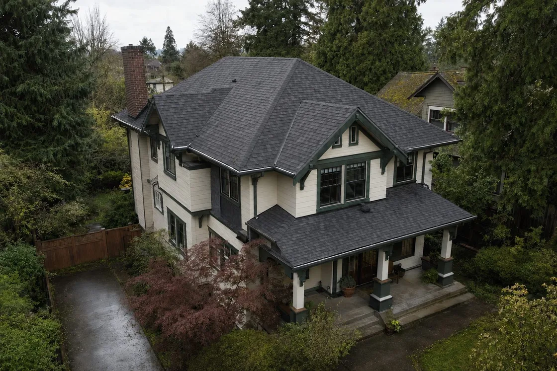 Malarkey Vista AR shingles in Midnight Black on a classic two-story home