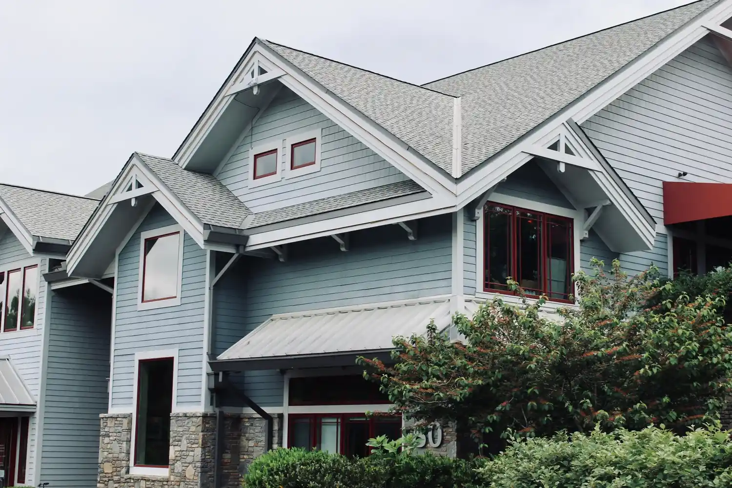 Blue-gray gabled home with coordinated siding and trim